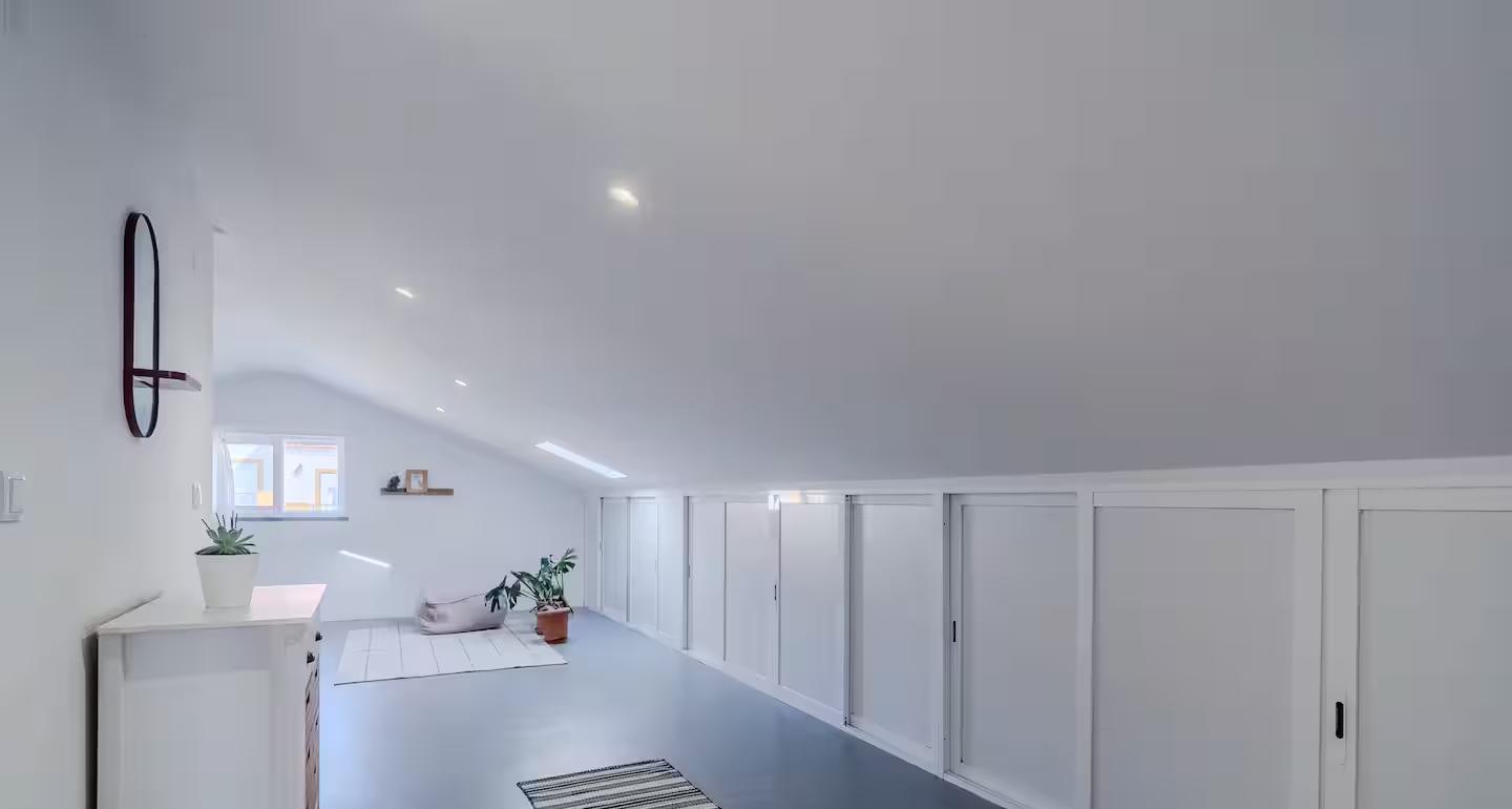 Built-in storage along the attic floor